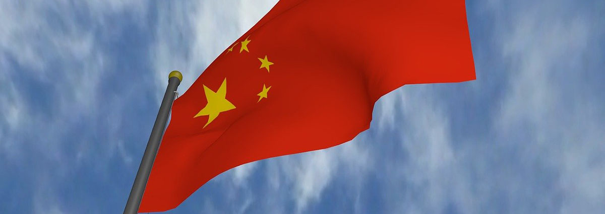 Chinese flag in front of blue sky