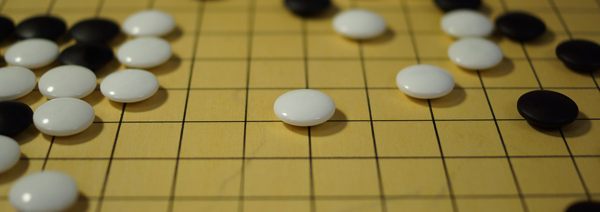 White and black pieces on a Go board
