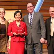 Haiyan Wang with the lecture trophy and Meredith McQuaid, Bob Griffin, and Tom Hanson