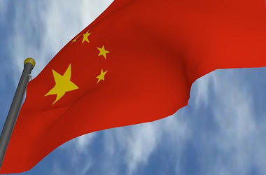 Chinese flag in front of blue sky